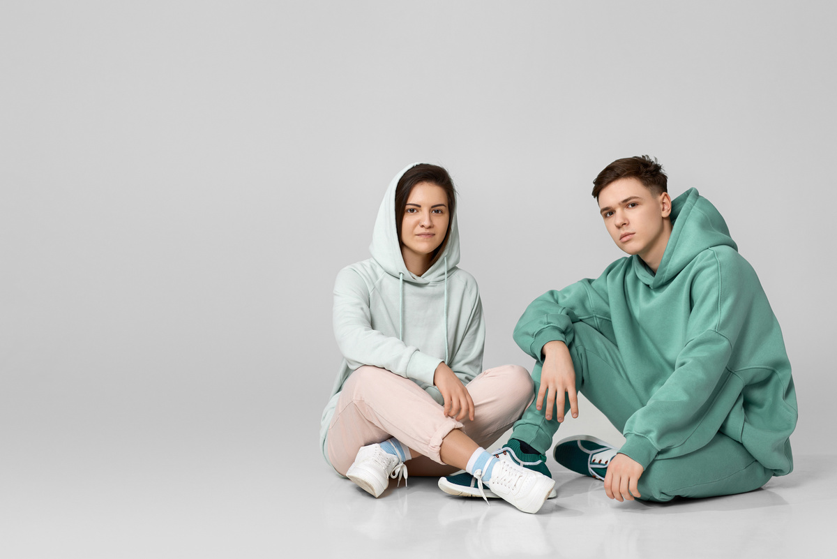 Young Couple Wearing Mint Green Casual Hoodie